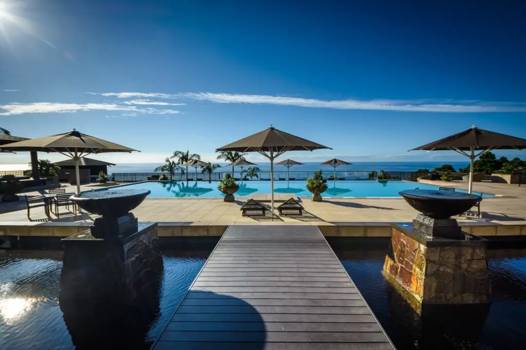 Luxury pool with deck and umbrellas
